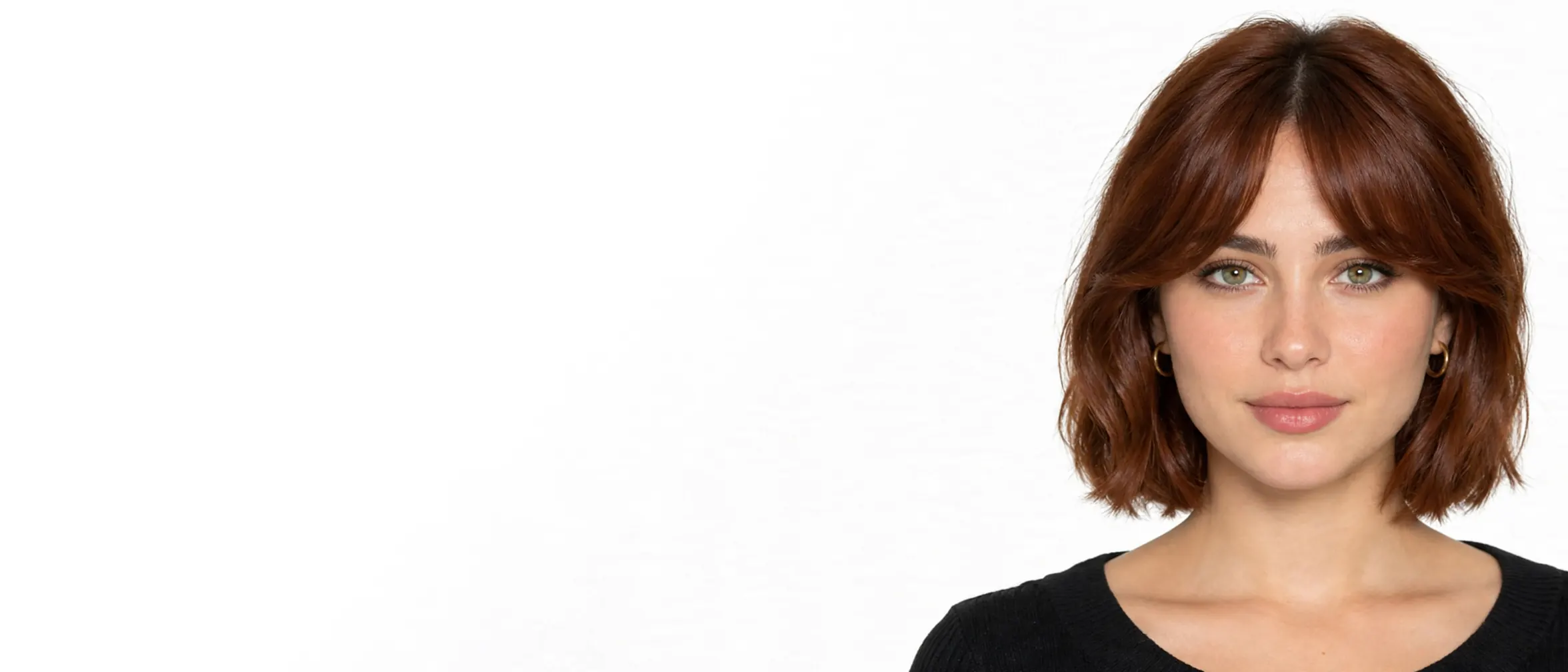 The portrait made with these choices: a woman in her twenties with green eyes and an auburn bob with curtain bangs, on a white background